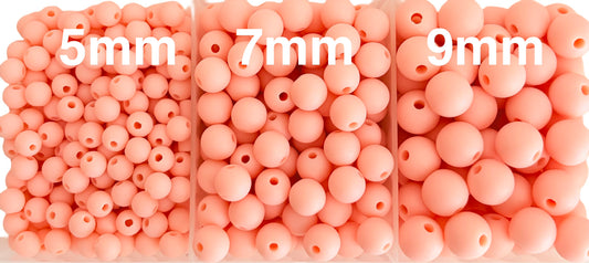 Three sets of peach-colored beads labeled 5mm, 7mm, and 9mm.
