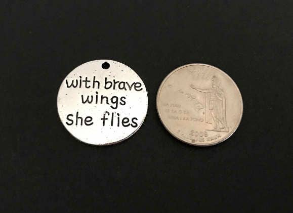 With brave wings she flies Charm