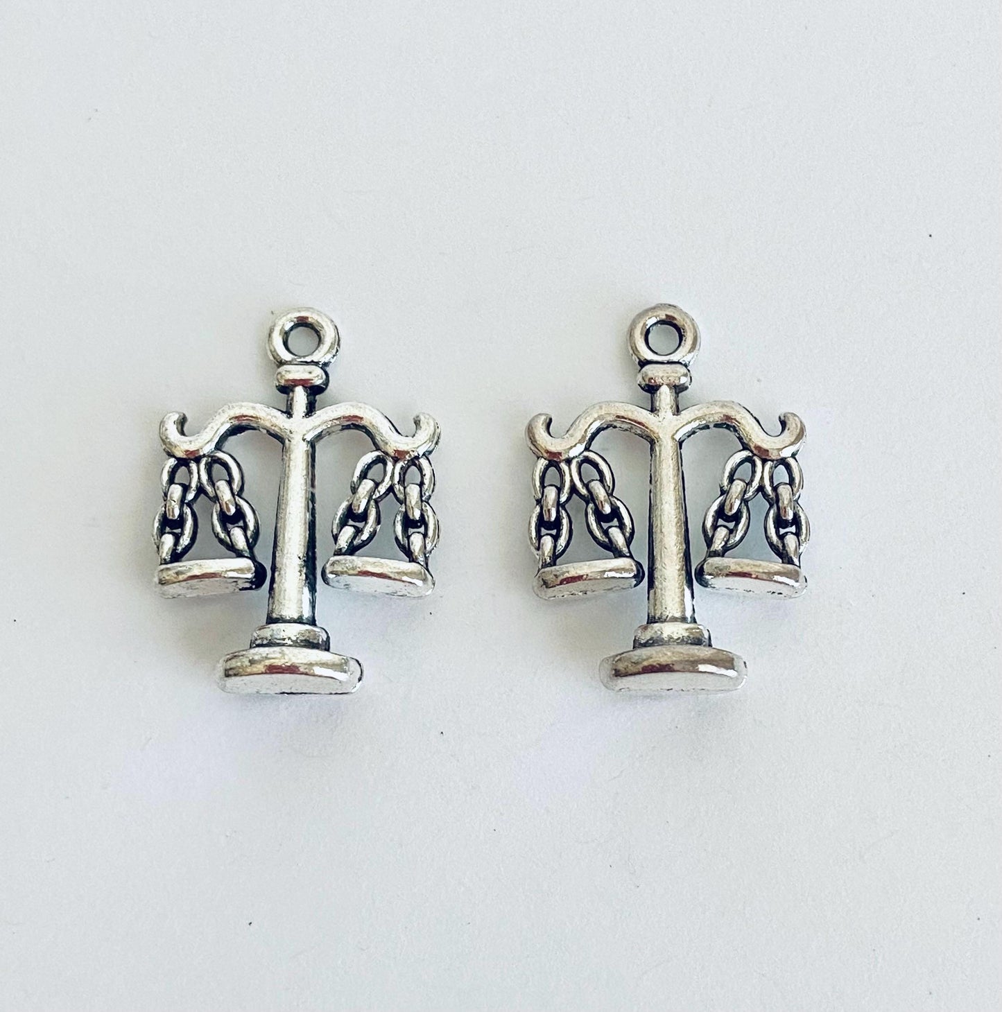 Scales Charm. Balance Charm