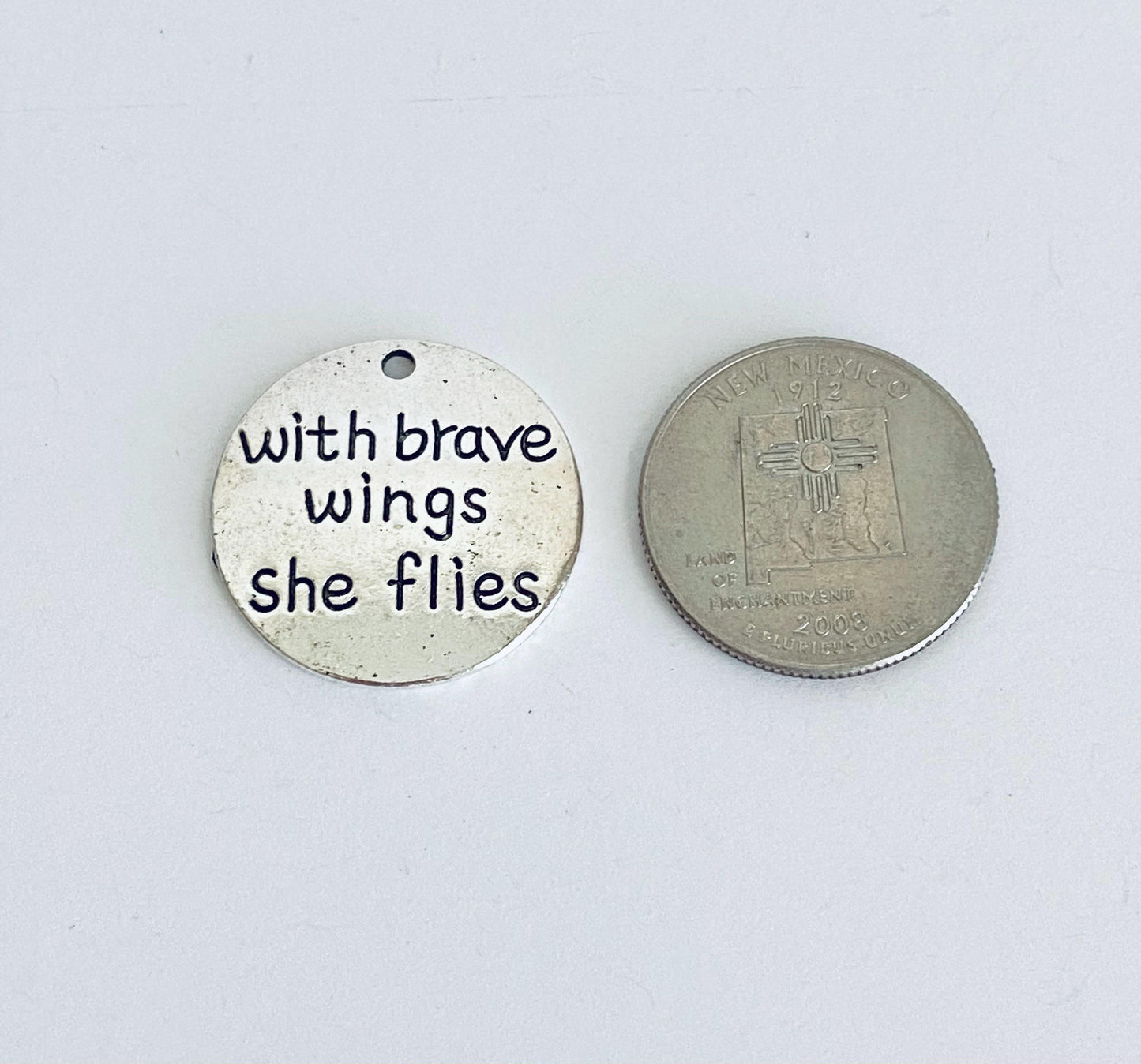 With brave wings she flies Charm