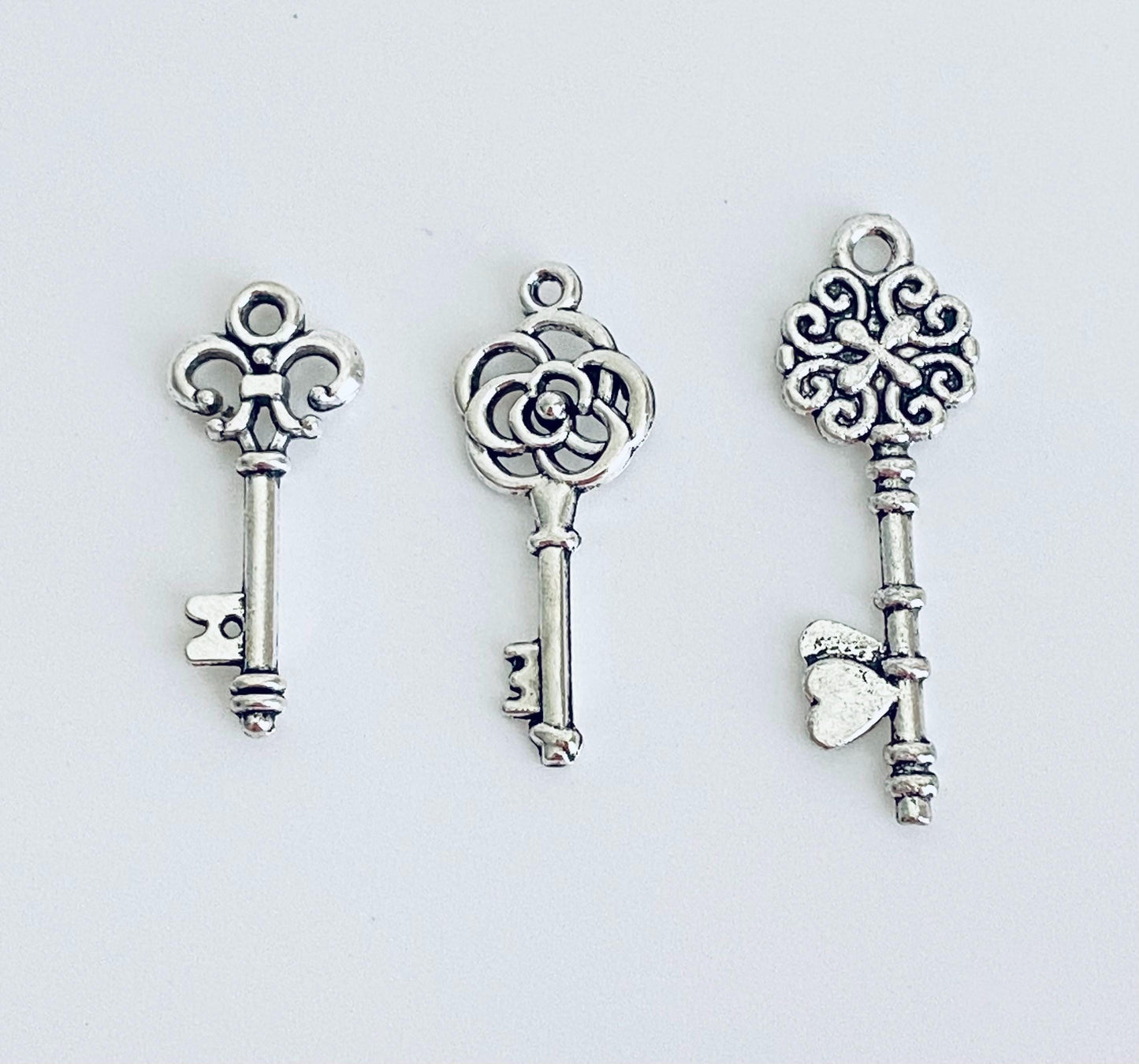 Base Metal Key Charm