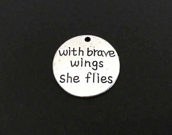 With brave wings she flies Charm