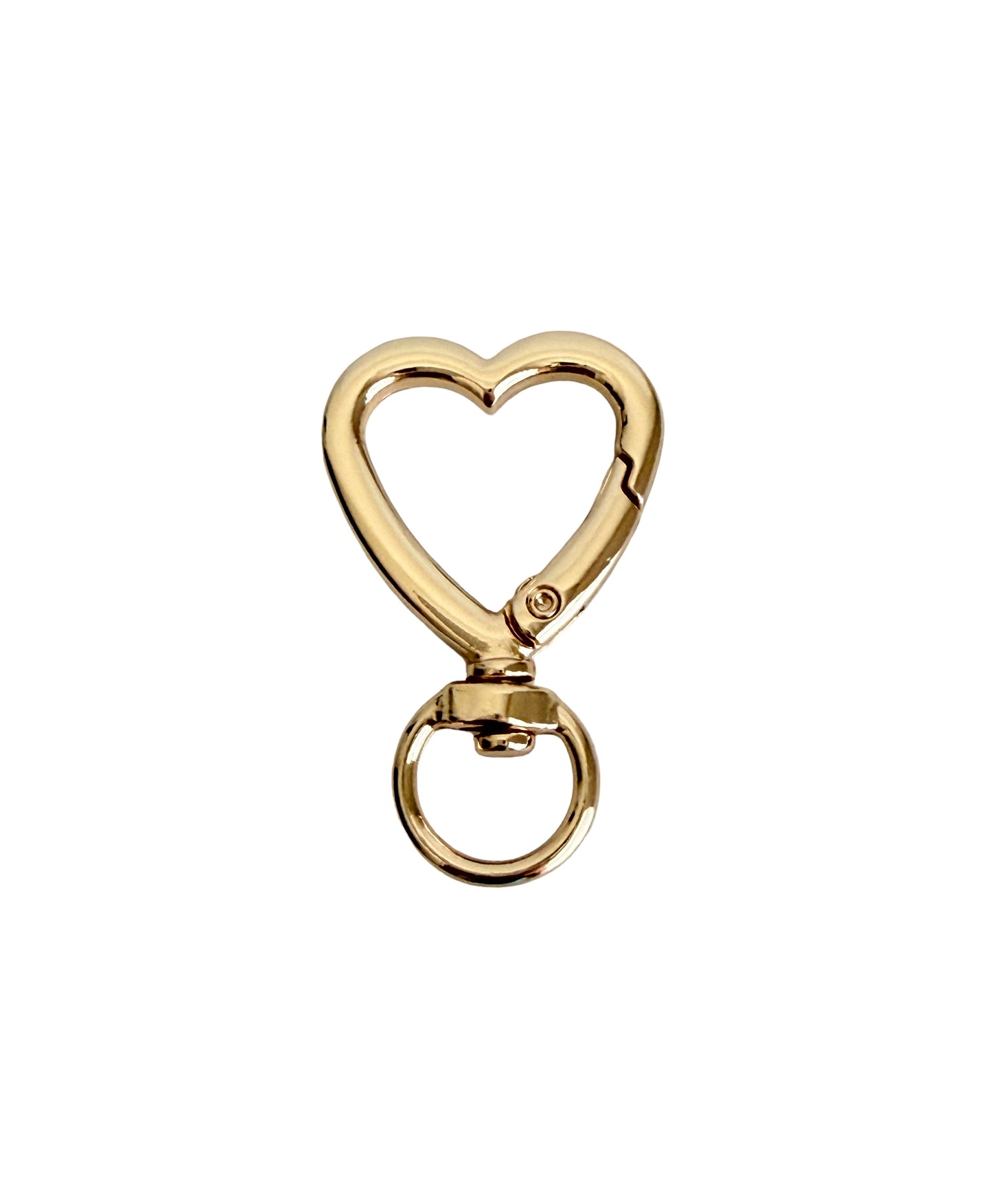 Gold heart-shaped keychain on a white background