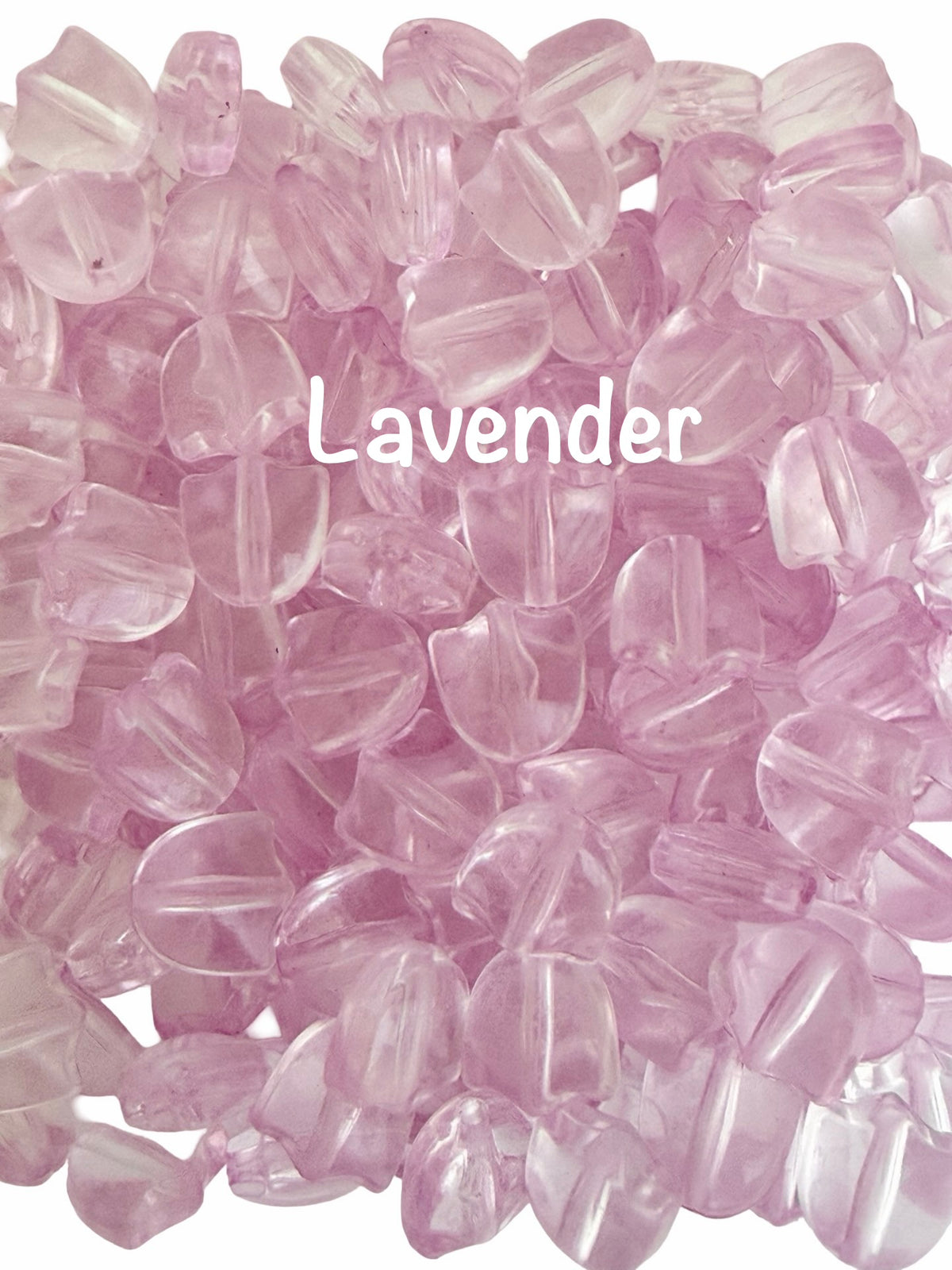 A pile of translucent lavender-colored glass beads with a white 'Lavender' text overlay in the center, set against a plain white background.