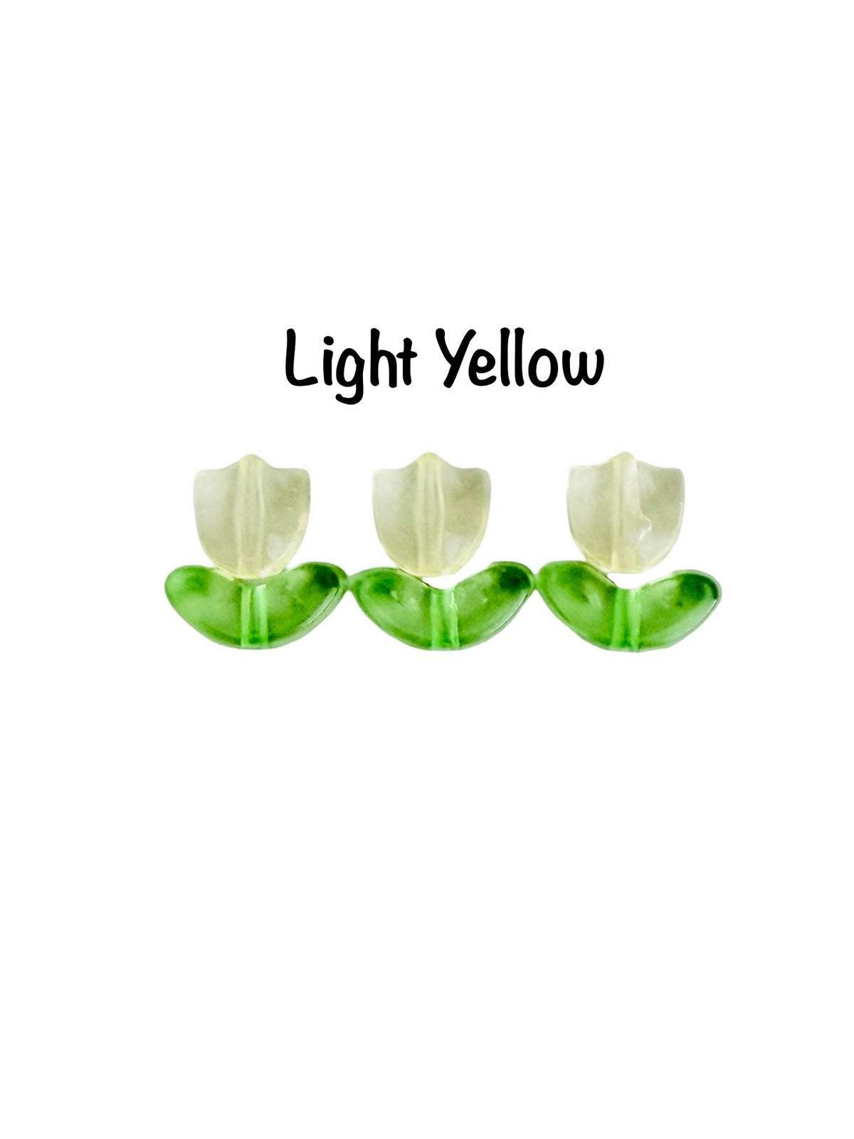Three tulip-shaped earrings in light yellow and green, arranged horizontally on a white background with the text 'Light Yellow' above them.