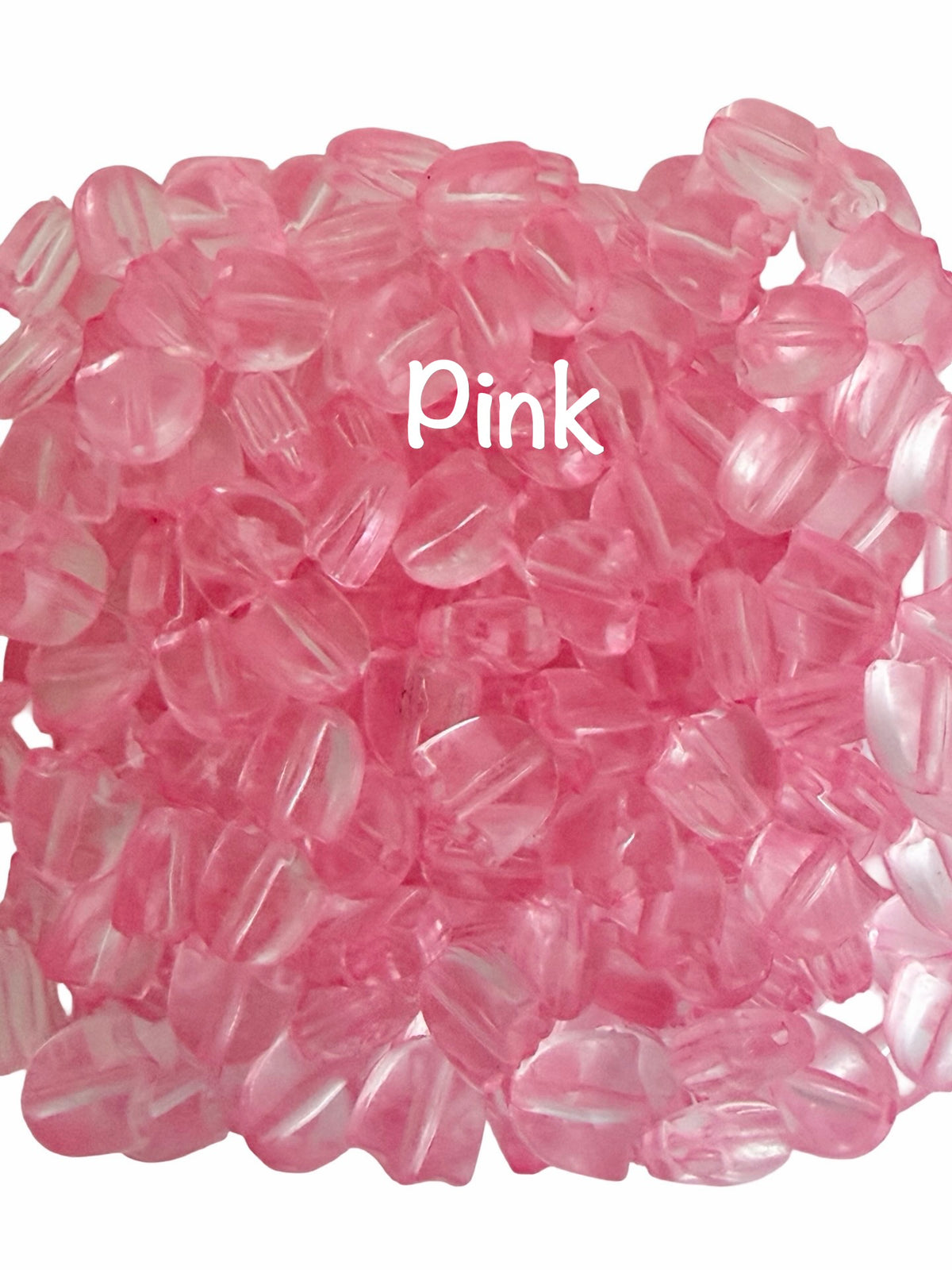 A pile of small translucent pink beads on a white background, with the word 'Pink' overlaid in white text near the center.