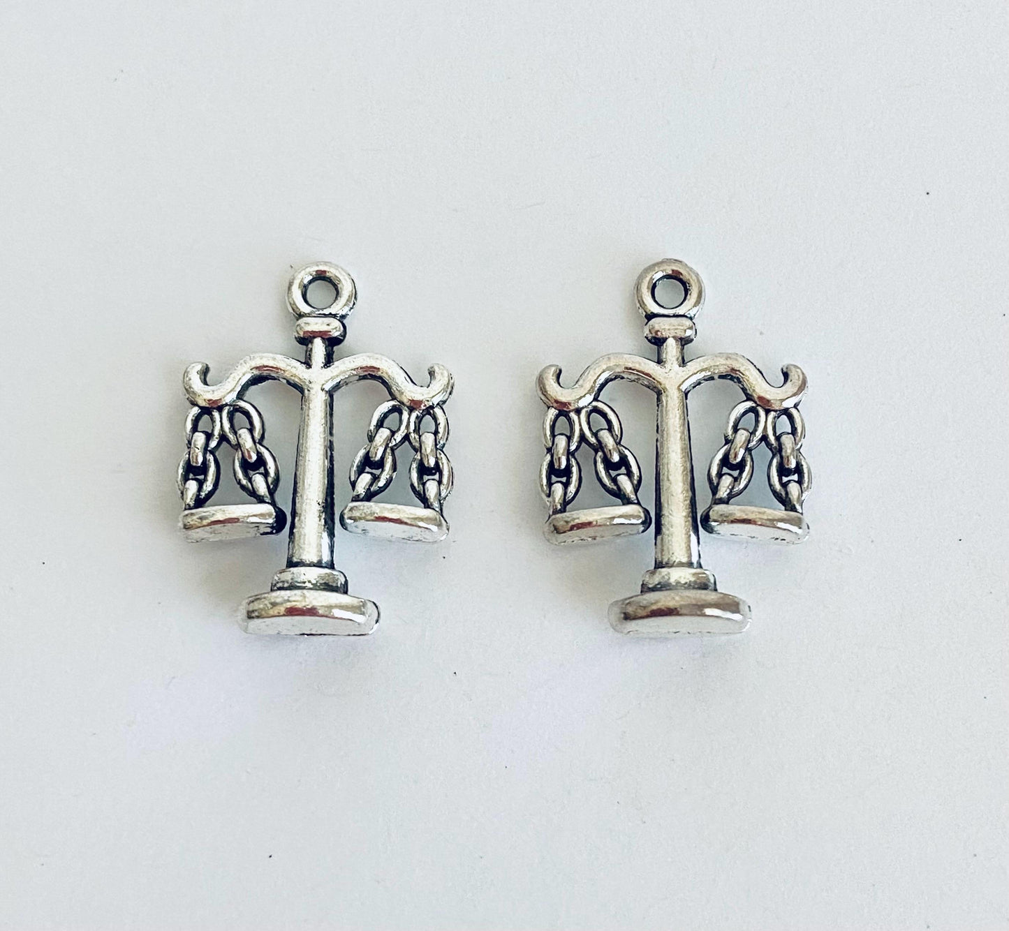 Scales Charm. Balance Charm