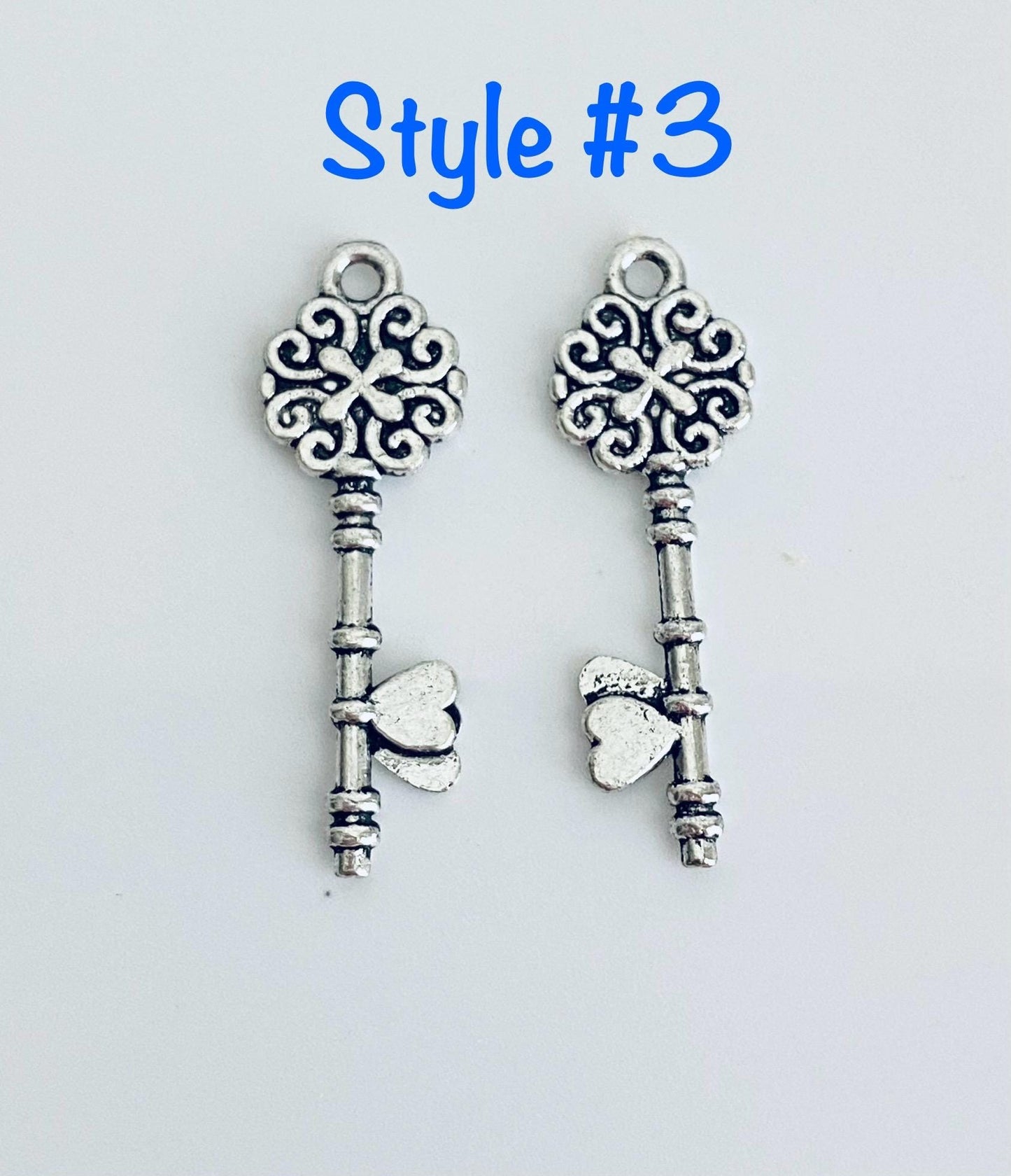 Base Metal Key Charm